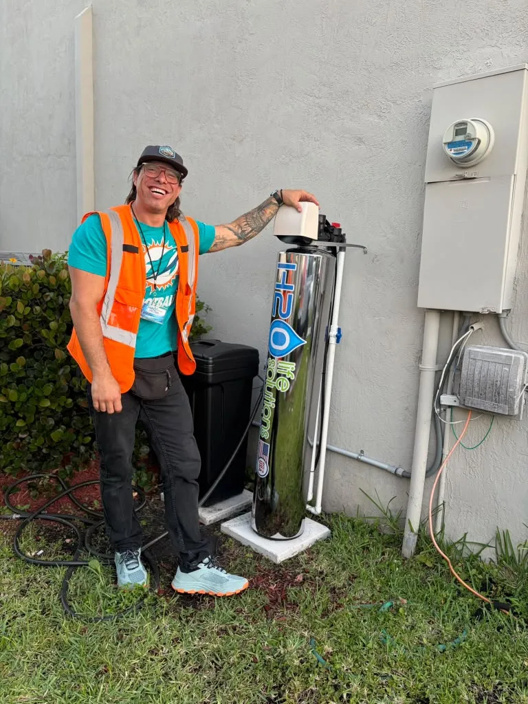 Whole-home water system installed outside a home